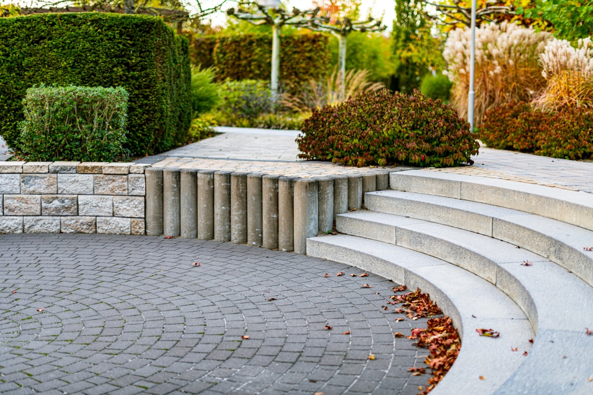 Japanese-inspired zen garden with water features and stone lanterns