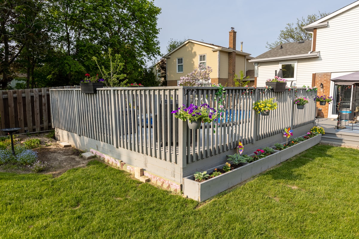 Professional landscape designer consulting with clients in a beautiful garden setting